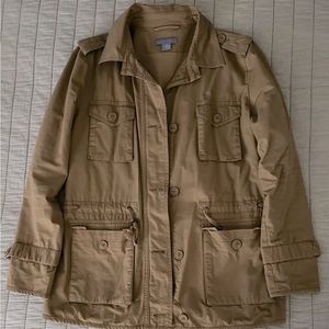 Light brown blazer type jacket. This jacket comes to your hip, has many pockets.